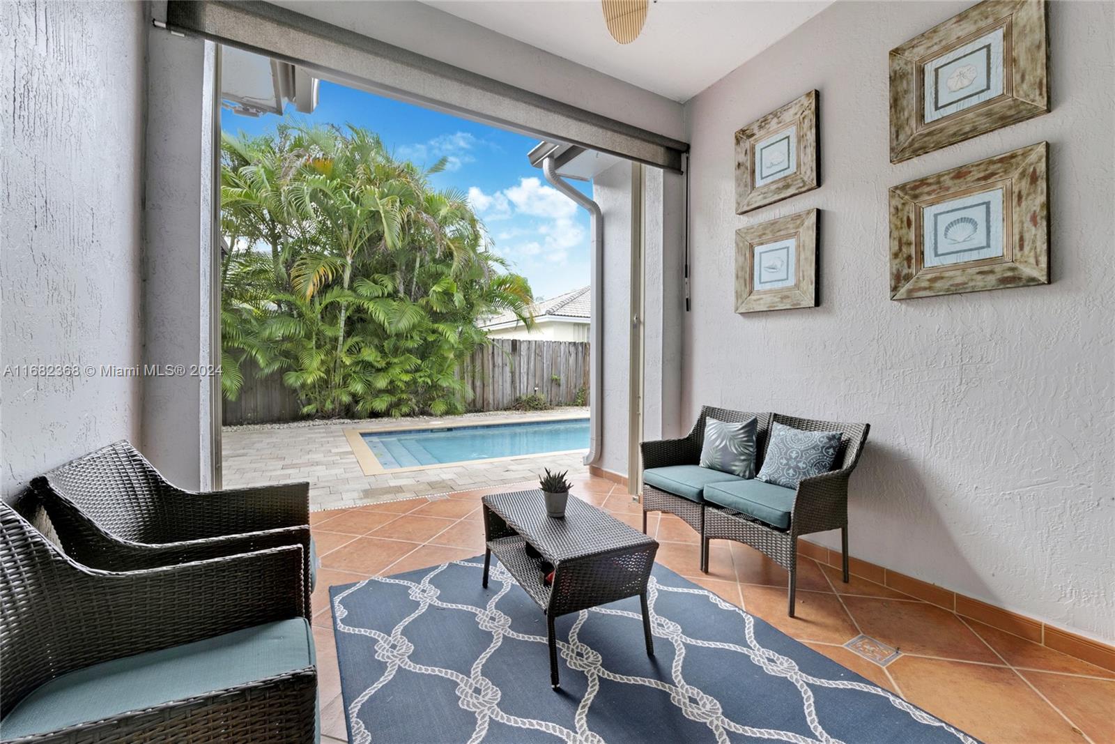 6850 Southwest 159th Place Miami, FL 33193 - Photo 16 of 18 a living room with furniture and a large window
