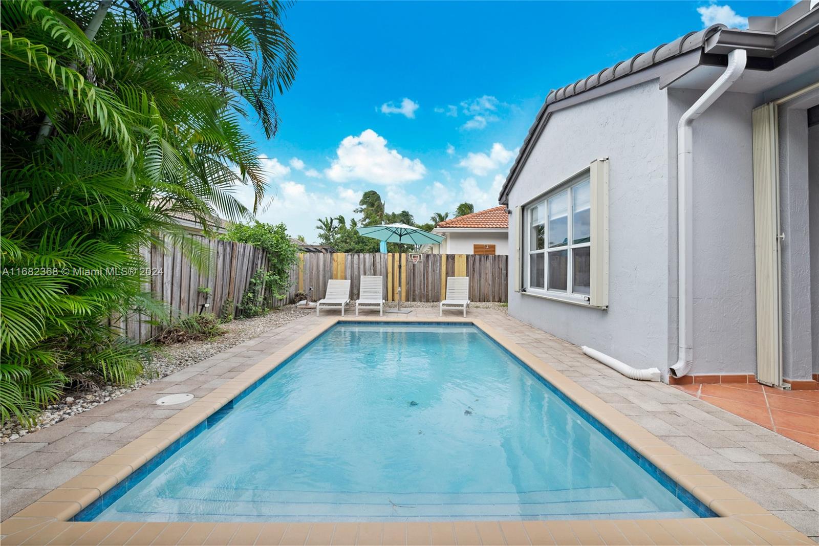 6850 Southwest 159th Place Miami, FL 33193 - Photo 18 of 18 a view of a house with backyard and garden