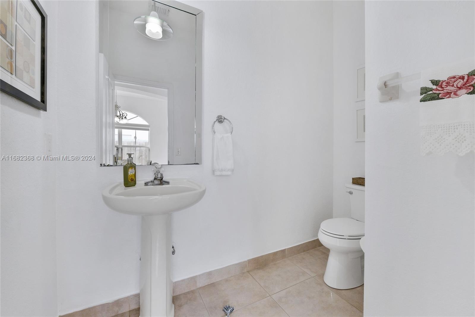 6850 Southwest 159th Place Miami, FL 33193 - Photo 9 of 18 a bathroom with a sink toilet and a mirror
