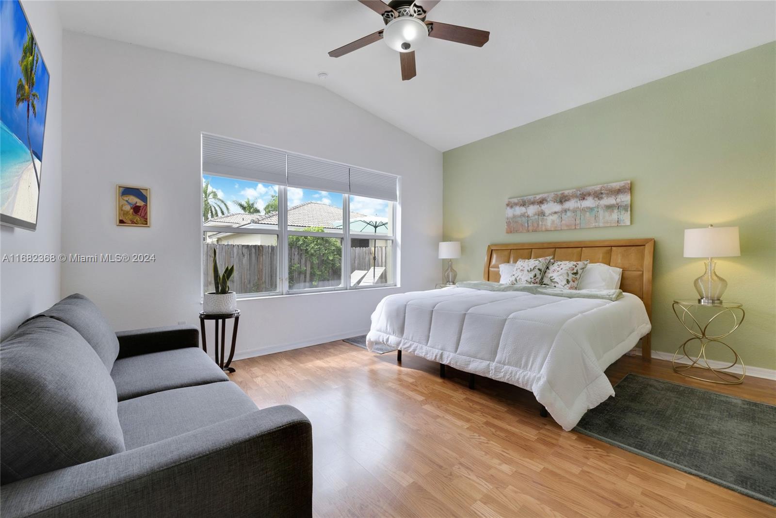 6850 Southwest 159th Place Miami, FL 33193 - Photo 10 of 18 a bedroom with a bed and a couch