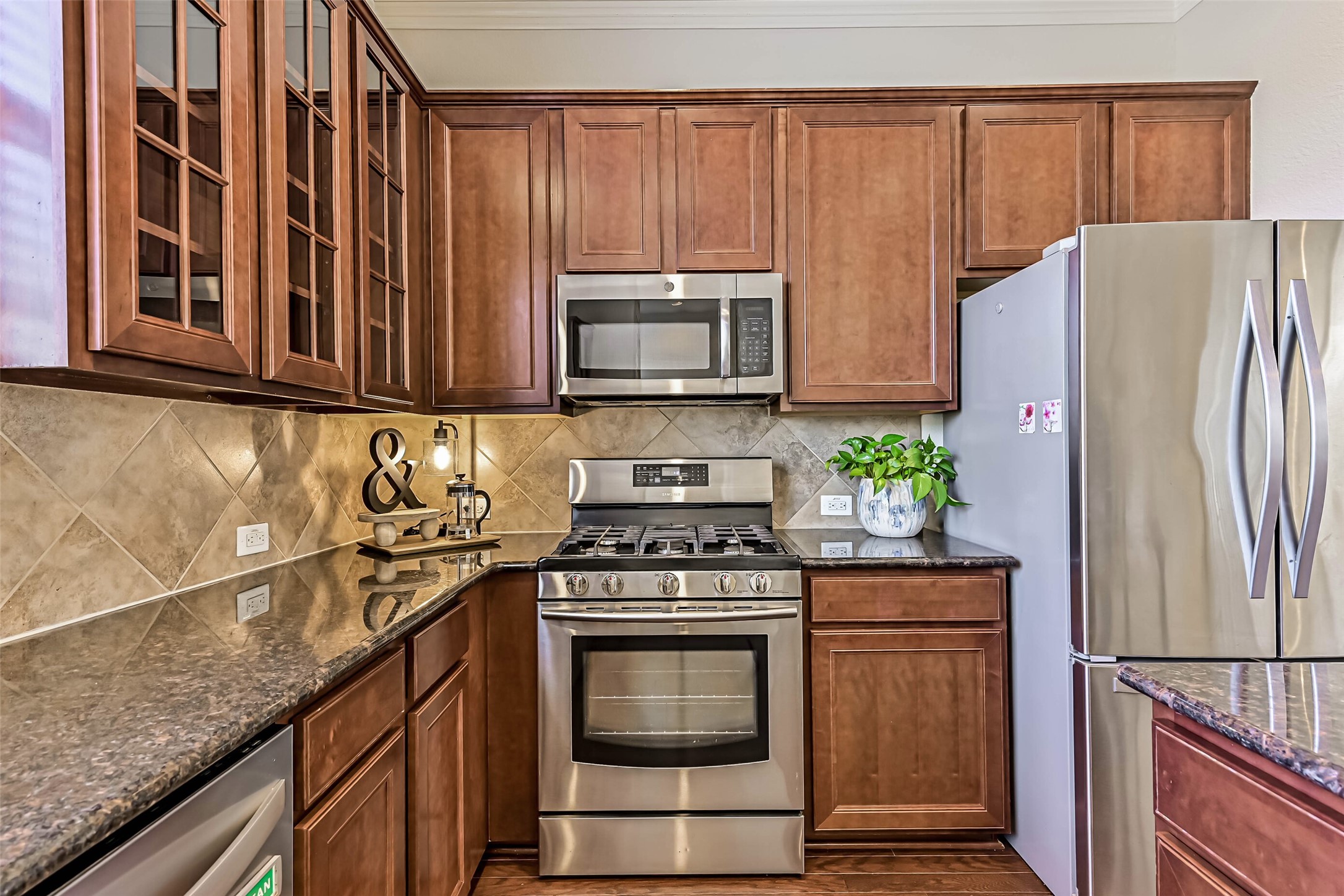 3208 Clearview Circle Houston, TX 77025 - Photo 13 of 30 Warm wood cabinetry, stainless appliances, and island seating make this kitchen easy to enjoy.