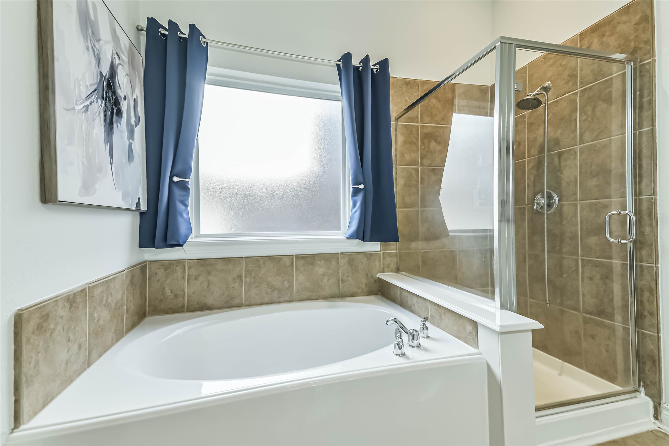 19022 Greenleaf Ridge Court Cypress, TX 77429 - Photo 28 of 47 a bathroom with a bathtub and a shower