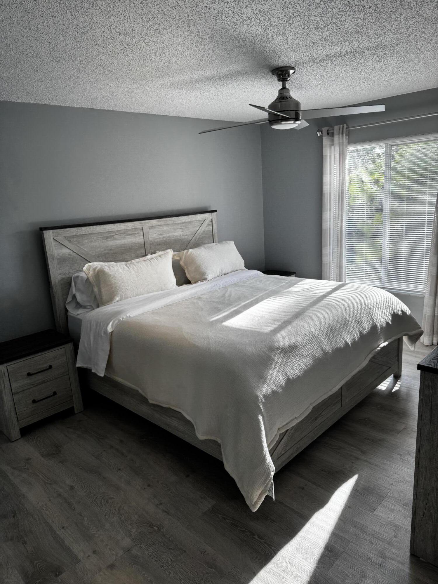 2502 Southeast Anchorage Cove, Unit G3 Port St. Lucie, FL 34952 - Photo 14 of 22 a bedroom with a bed and a window