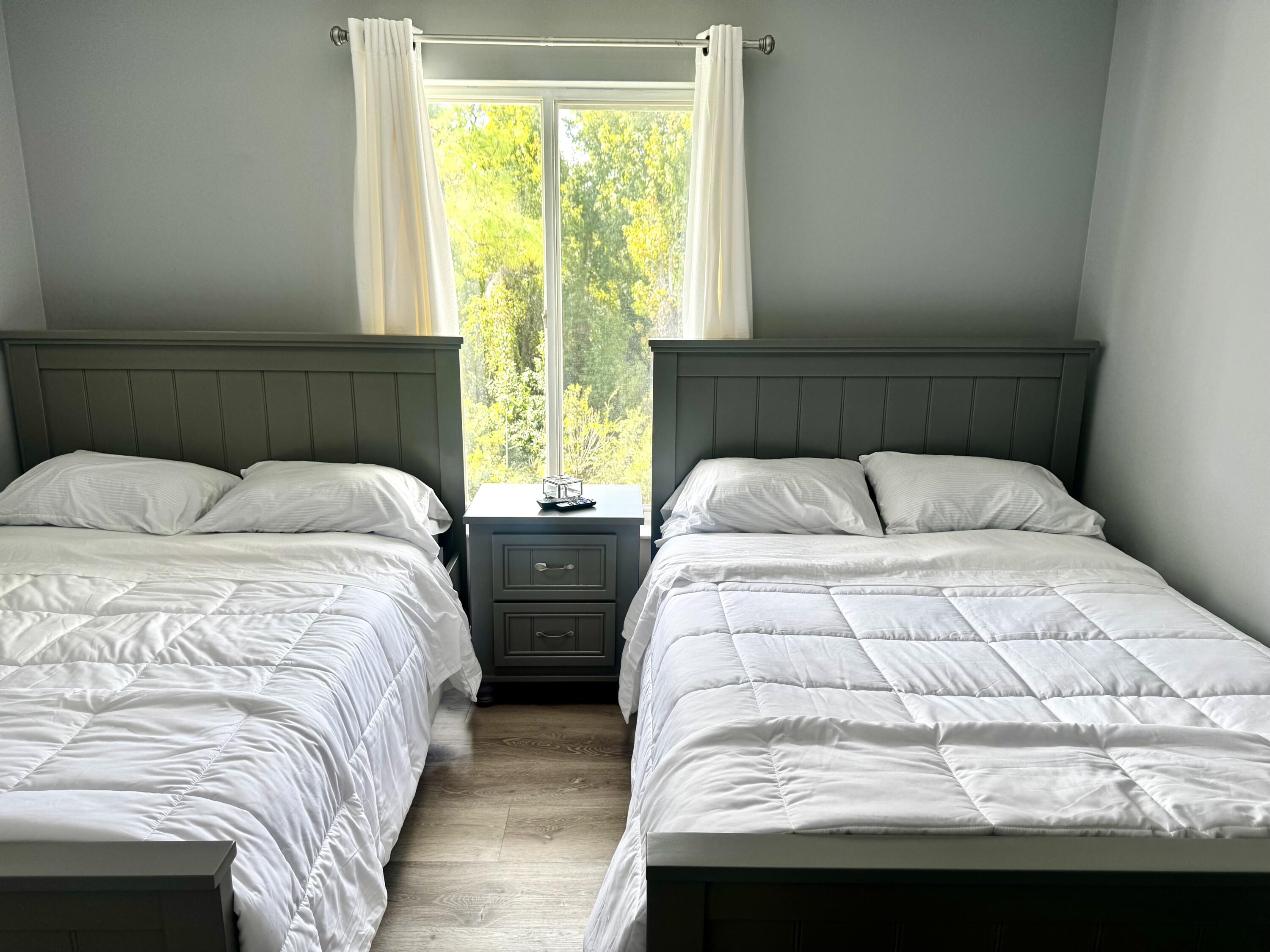 2502 Southeast Anchorage Cove, Unit G3 Port St. Lucie, FL 34952 - Photo 18 of 22 a bedroom with two beds and a window