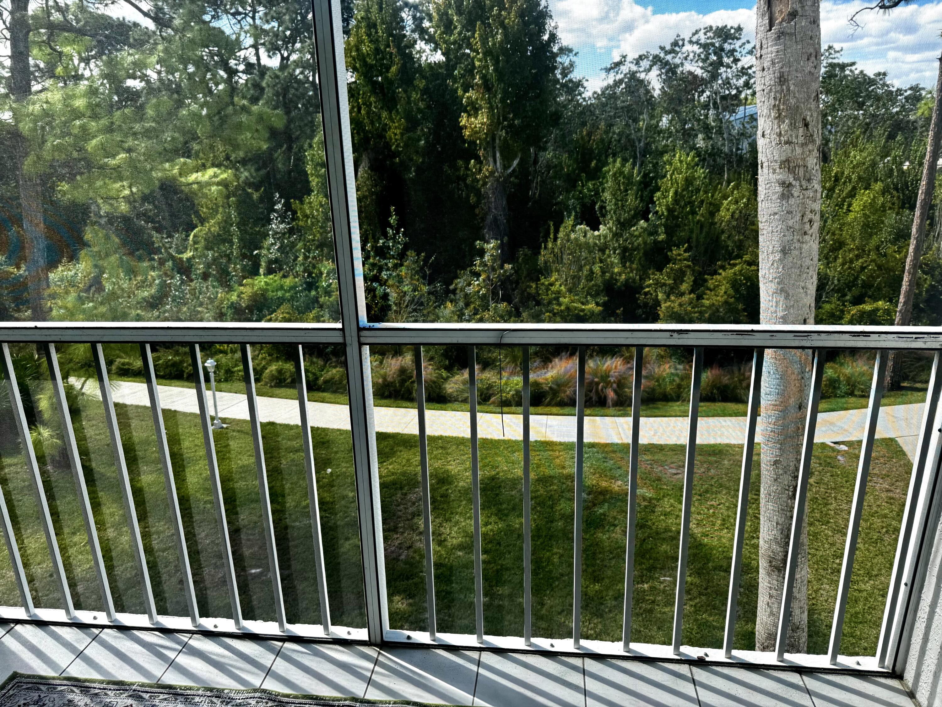 2502 Southeast Anchorage Cove, Unit G3 Port St. Lucie, FL 34952 - Photo 3 of 22 a view of a wooden fence