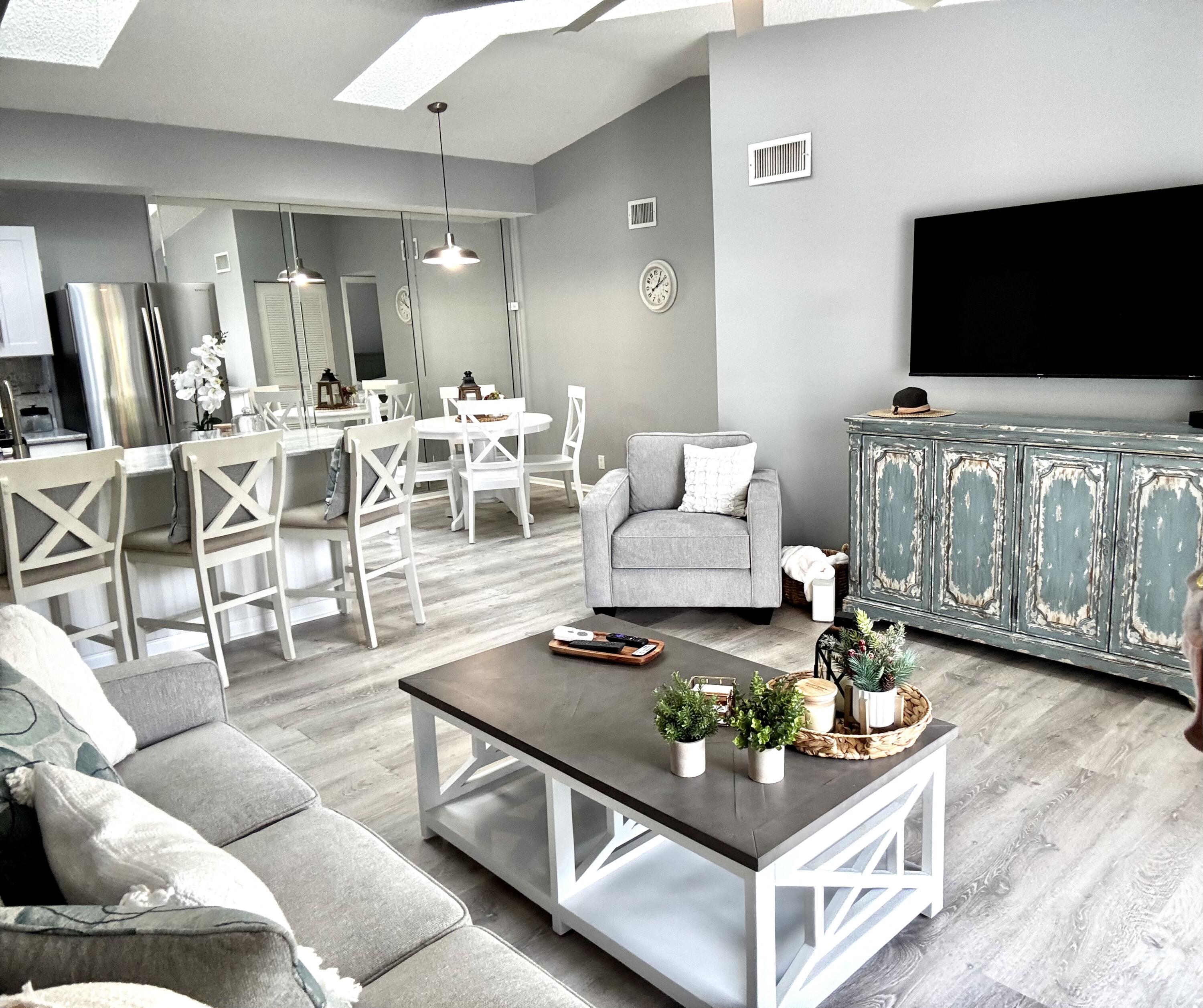 2502 Southeast Anchorage Cove, Unit G3 Port St. Lucie, FL 34952 - Photo 6 of 22 a living room with furniture and a flat screen tv