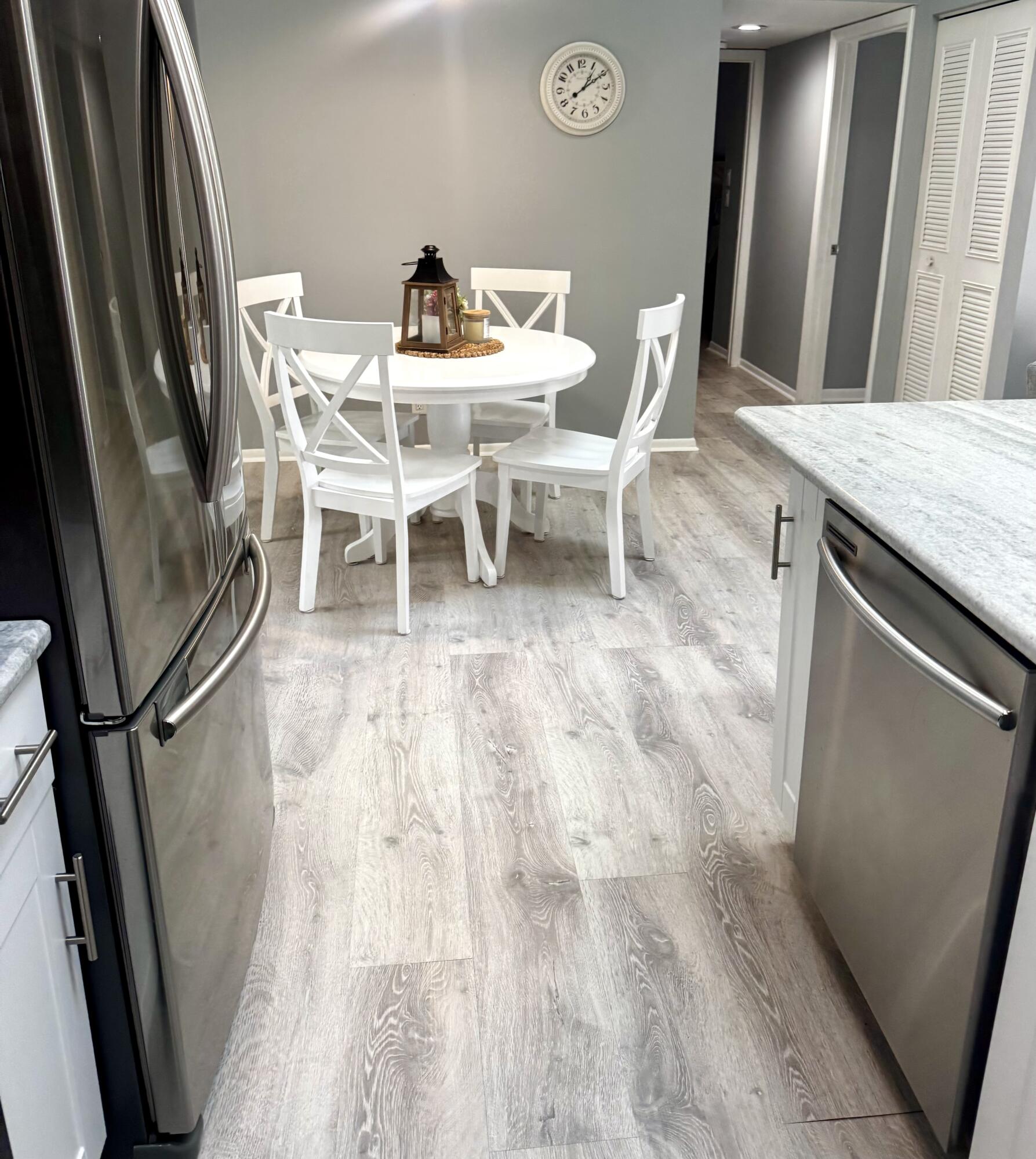 2502 Southeast Anchorage Cove, Unit G3 Port St. Lucie, FL 34952 - Photo 10 of 22 a view of a dining room with furniture and wooden floor