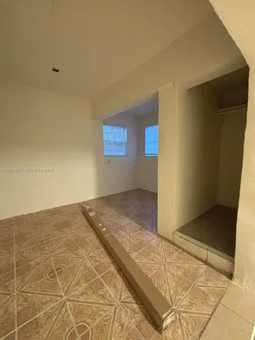 a view of a backyard with sitting area