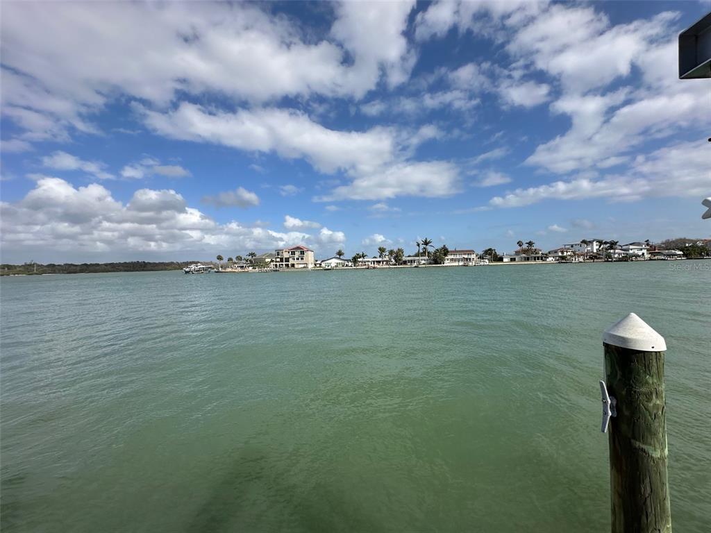 575 Crystal Drive Madeira Beach, FL 33708 - Photo 18 of 75 a view of a lake with houses in the back