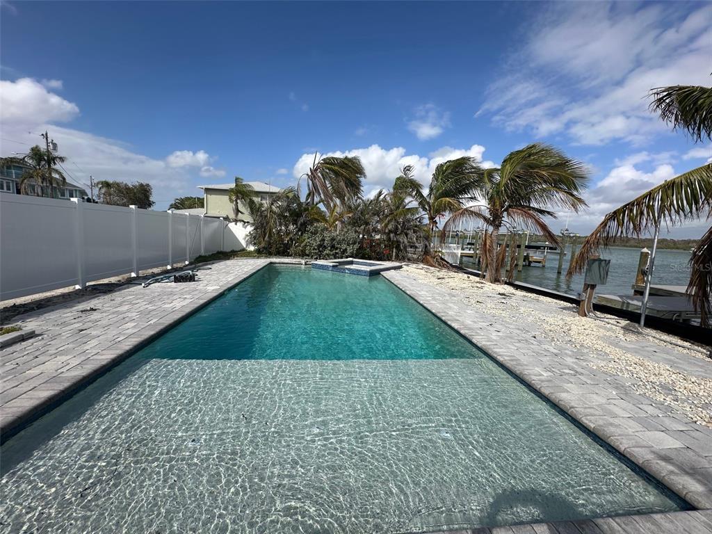 575 Crystal Drive Madeira Beach, FL 33708 - Photo 23 of 75 a view of a swimming pool with a patio