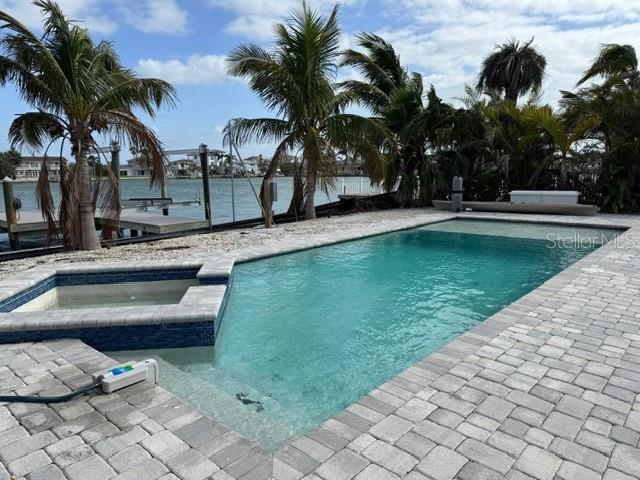 575 Crystal Drive Madeira Beach, FL 33708 - Photo 24 of 75 a view of swimming pool with chairs
