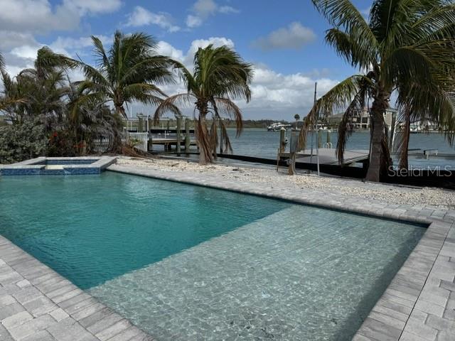 575 Crystal Drive Madeira Beach, FL 33708 - Photo 26 of 75 a view of a backyard with swimming pool
