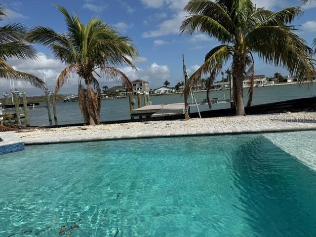 575 Crystal Drive Madeira Beach, FL 33708 - Photo 28 of 75 a view of a yard and palm trees