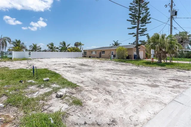 an aerial view of a house with a ocean view