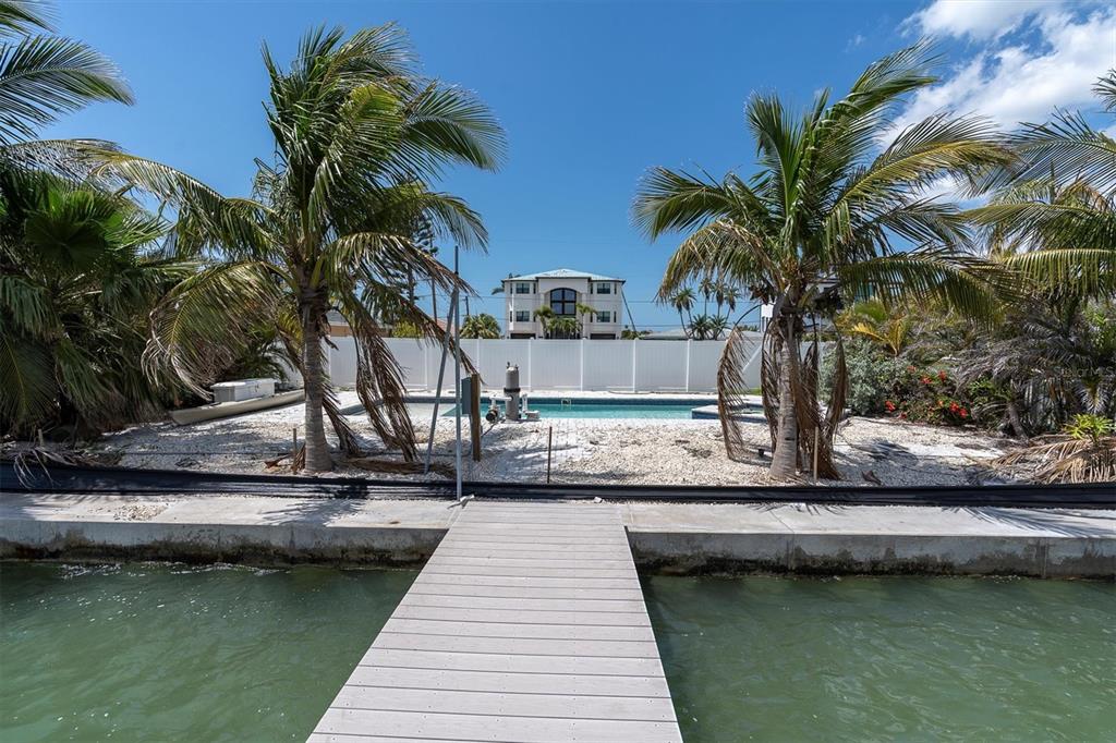 575 Crystal Drive Madeira Beach, FL 33708 - Photo 45 of 75 a view of swimming pool with chairs