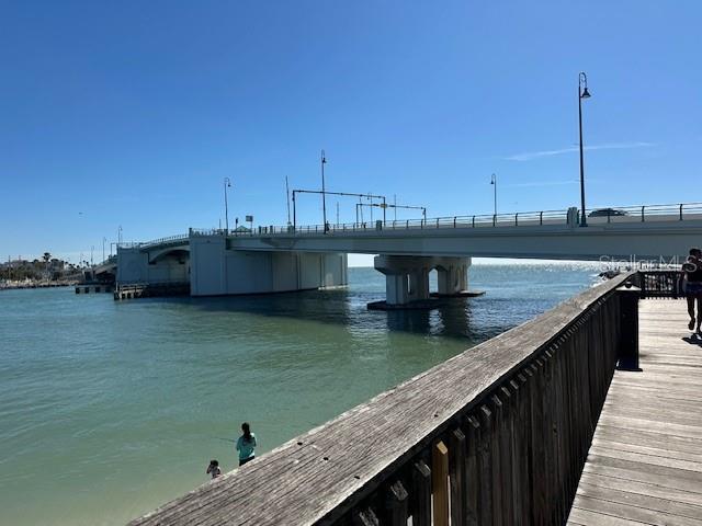 575 Crystal Drive Madeira Beach, FL 33708 - Photo 53 of 75 a view of a lake with a bridge