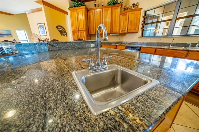 a living room with lots of furniture and a large window