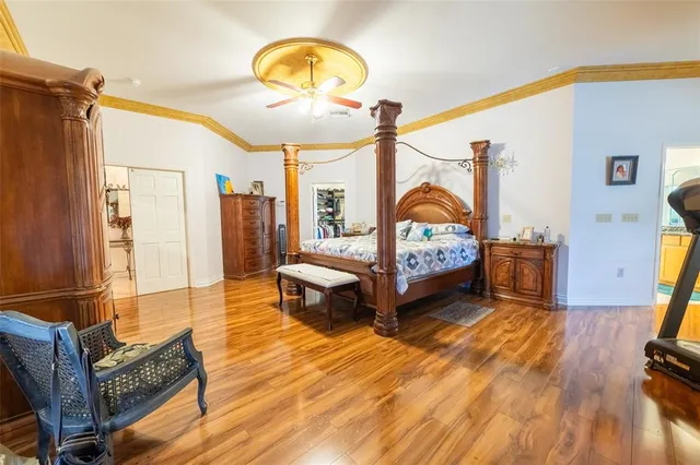 a spacious bathroom with a granite countertop sink and a mirror