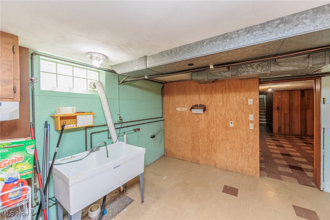 5445 Hauserman Road Cleveland, OH 44130 - Photo 39 of 45 Basement featuring light tile patterned floors and sink