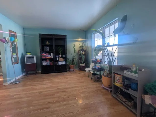 a view of a livingroom with furniture and an empty room