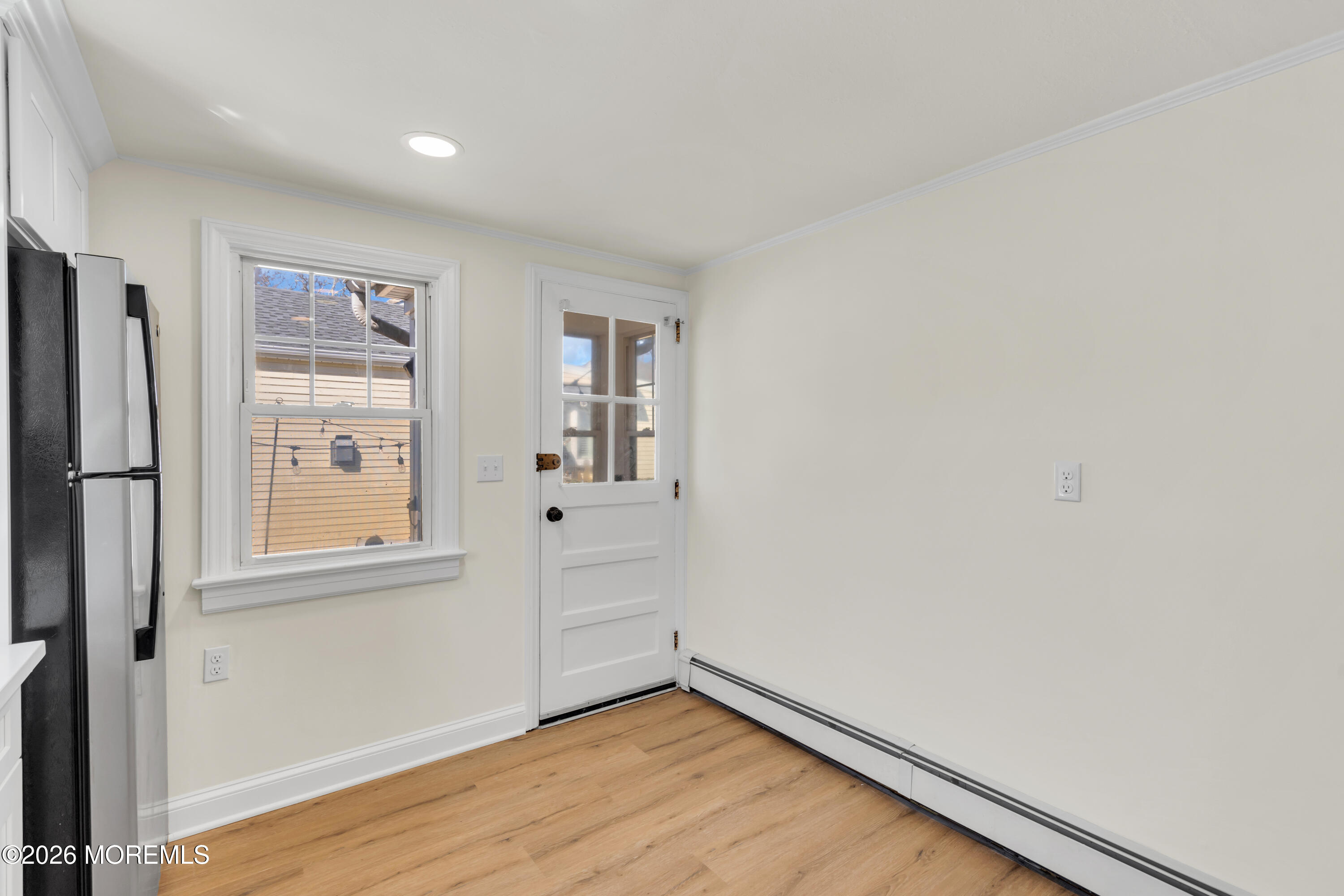 137 Inskip Avenue Ocean Grove, NJ 07756 - Photo 38 of 39 a view of empty room with wooden floor and fan