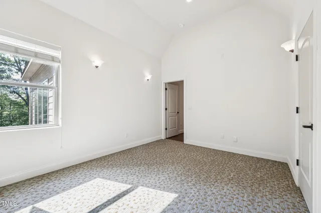 a aerial view of a house with yard and green space