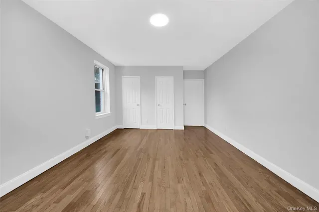 a white toilet sitting next to a bathroom sink and tub