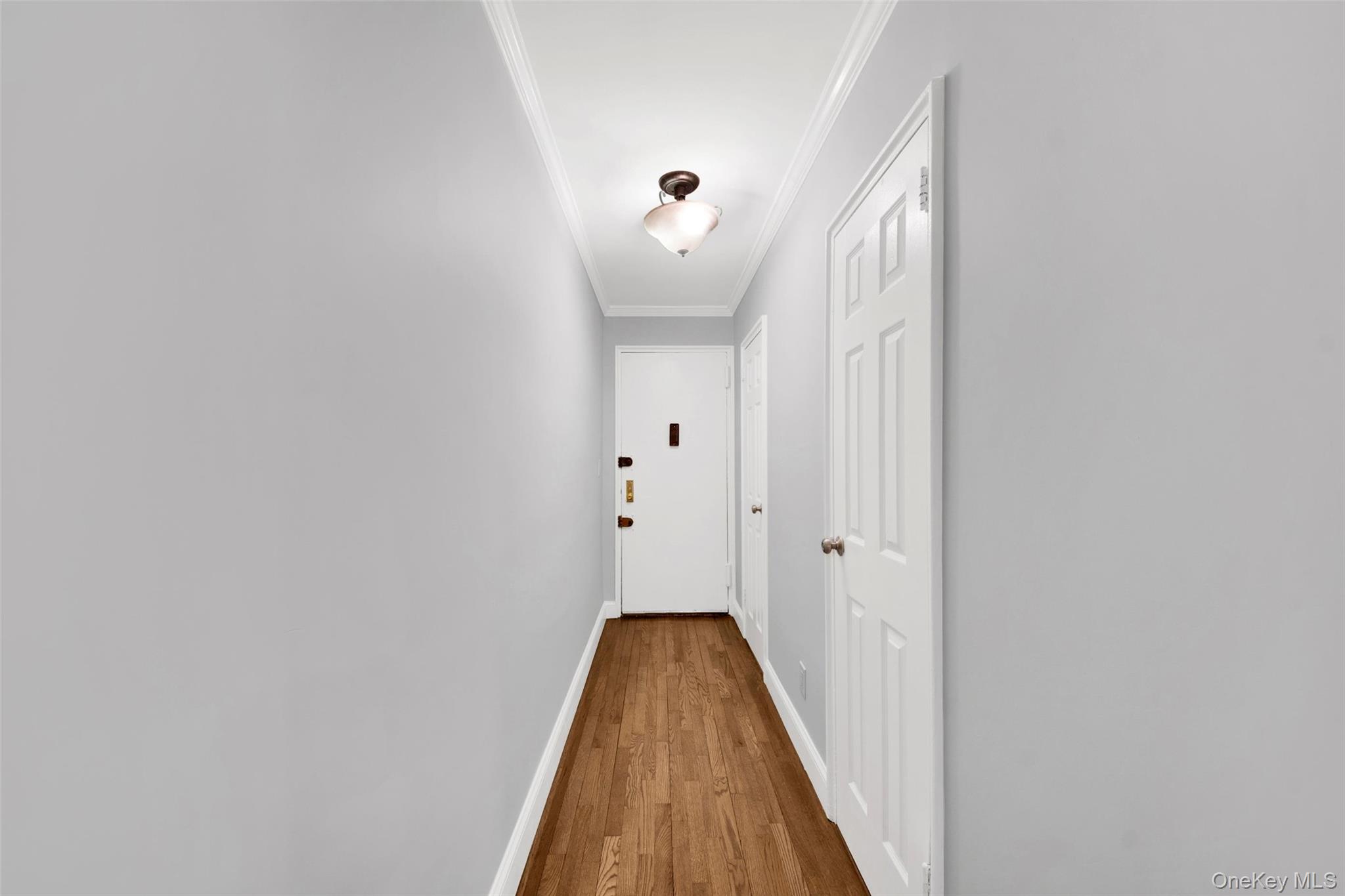 1 Vincent Road, Unit 2N Yonkers, NY 10708 - Photo 17 of 19 a view of a hallway with wooden floor