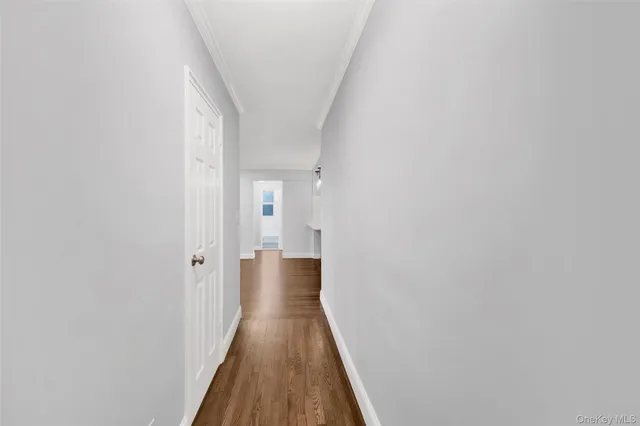 a utility room with furniture and a rug