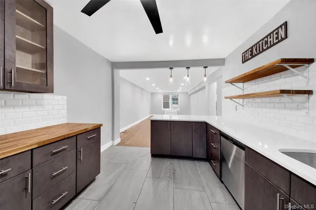 a kitchen with stainless steel appliances a sink and a stove