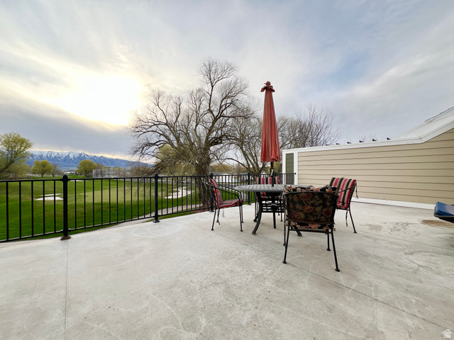 1017 South 275 West Logan, UT 84321 - Photo 25 of 36 View of patio / terrace featuring outdoor dining area and a mountain view
