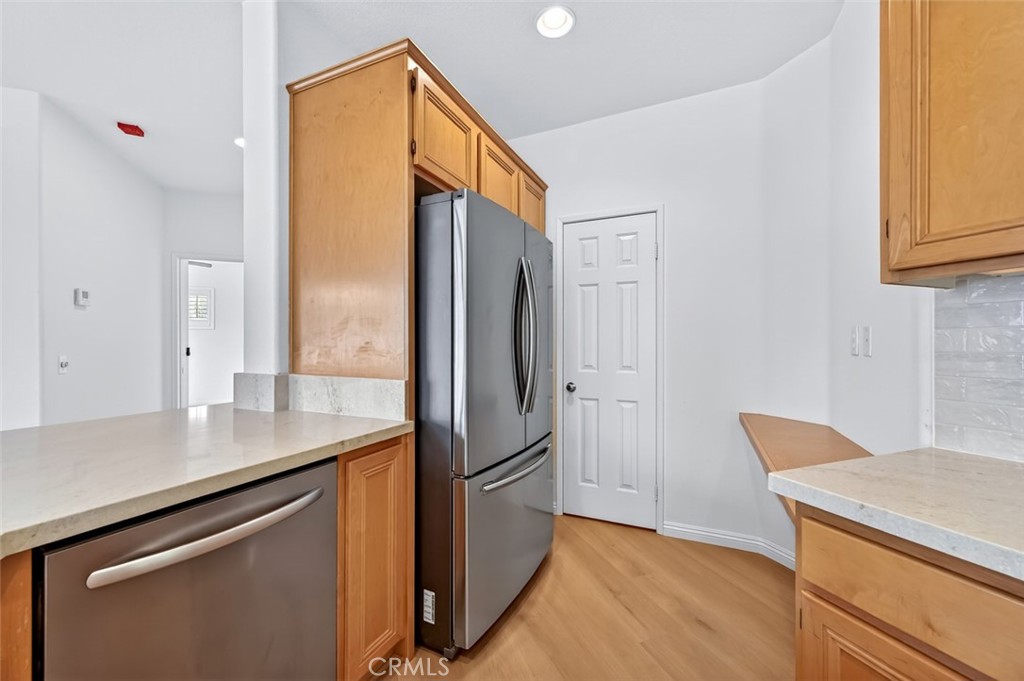 447 Ridgeway Irvine, CA 92620 - Photo 71 of 88 a kitchen with stainless steel appliances a refrigerator and a stove