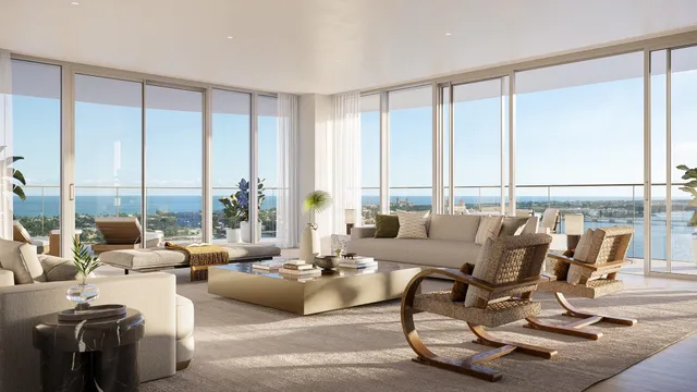 a living room with furniture and floor to ceiling windows