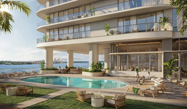 a view of a building with a swimming pool and a chairs