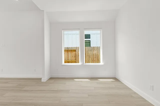 a kitchen with stainless steel appliances granite countertop a sink a stove and cabinets