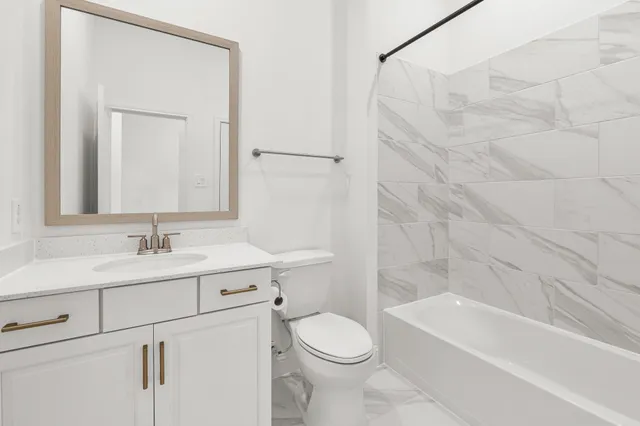 a view of a house with yard and a garden