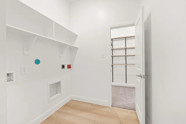 an aerial view of residential houses with outdoor space and swimming pool