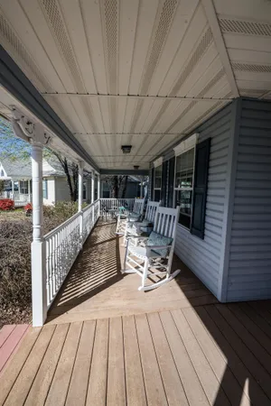 a view of a patio with wooden floor