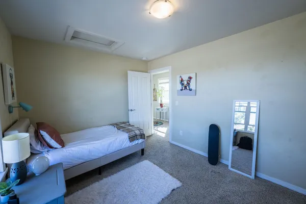 a bedroom with furniture and window