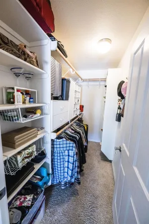 a bedroom with bed and a window