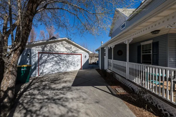 a view of a pathway of a house with a yard