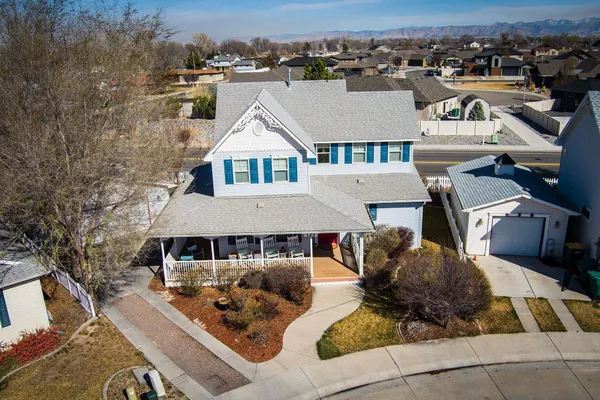 an aerial view of a house with swimming pool