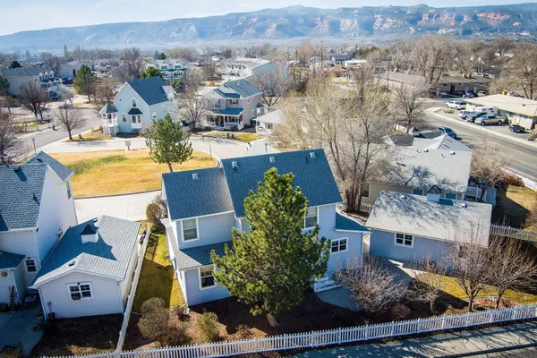 an aerial view of residential houses with outdoor space