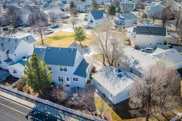 an aerial view of a house with garden space and street view