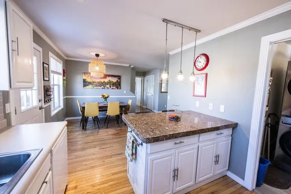a view of a kitchen area with furniture and window