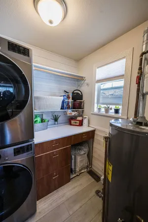 a kitchen with a sink appliances and cabinets