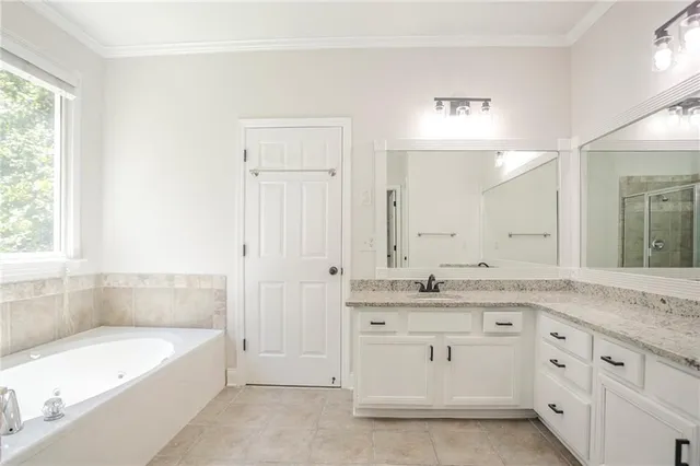 a bathroom with a bathtub and window