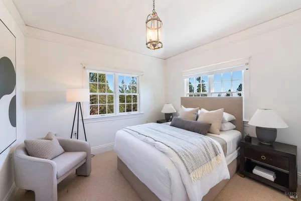 a bedroom with bed and window