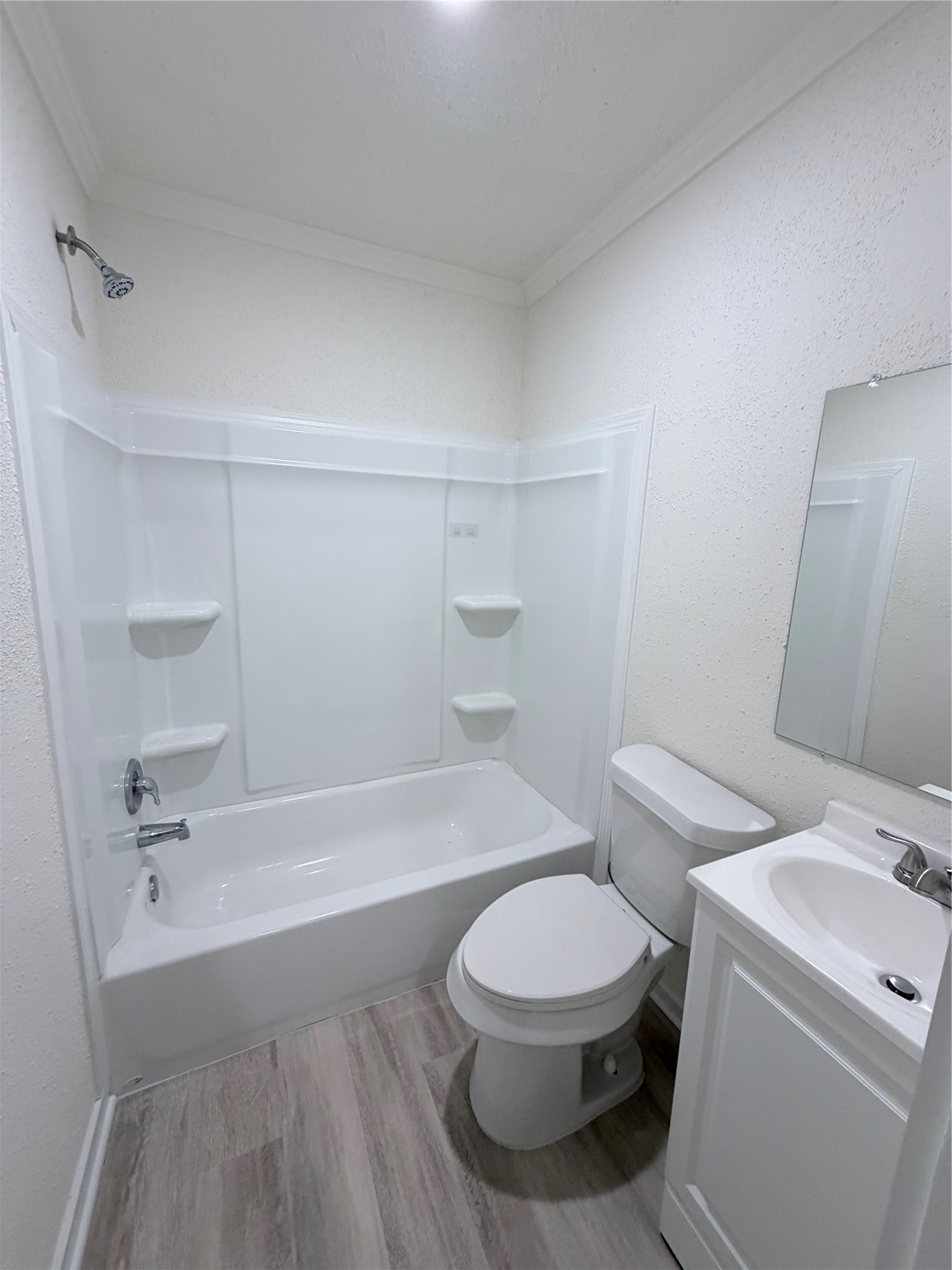 1112 3rd Street La Marque, TX 77568 - Photo 16 of 21 a white toilet sitting next to a bath tub