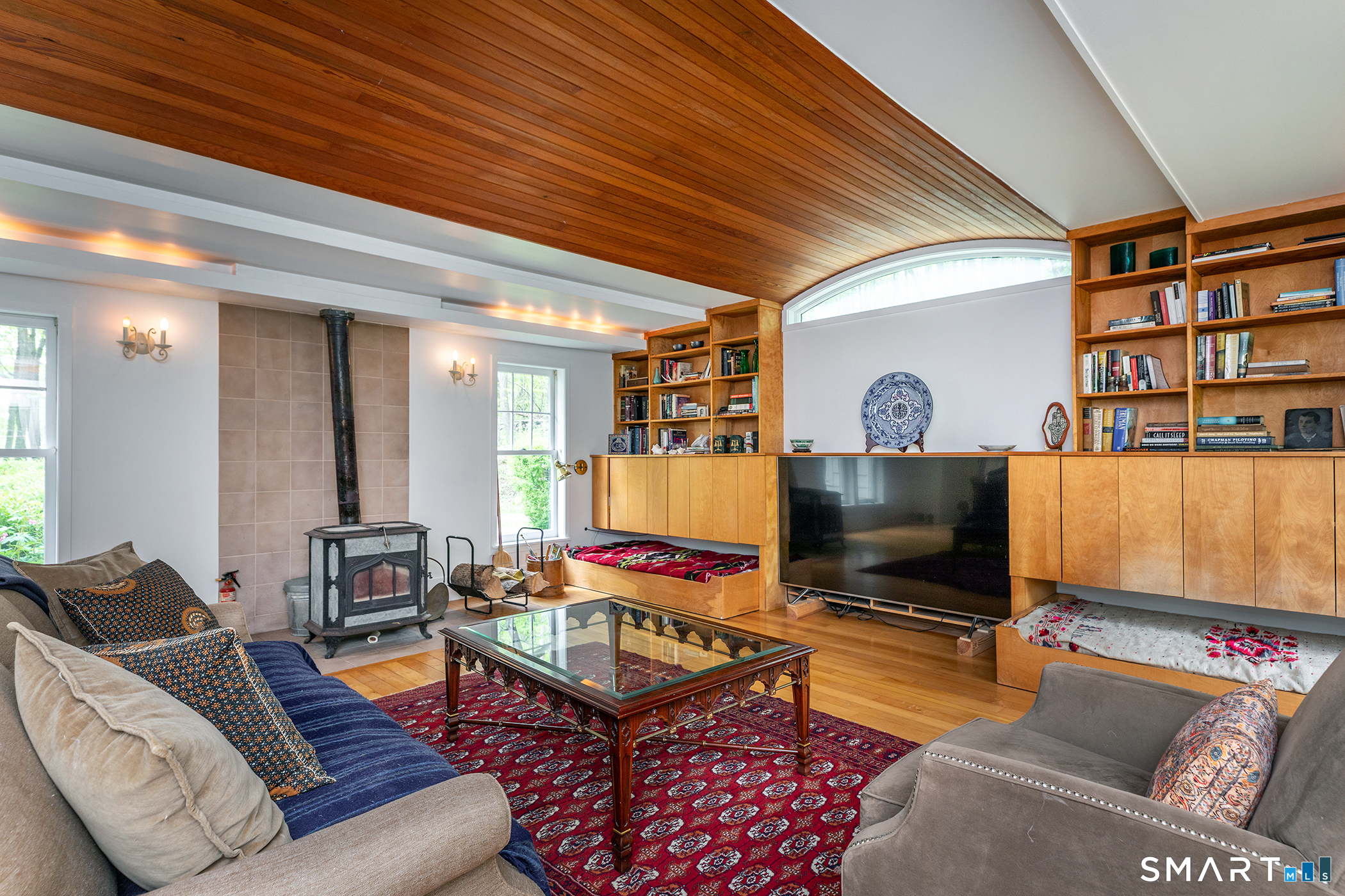 56 Todd Hill Road Cornwall, CT 06796 - Photo 12 of 30 Note the arched wooden ceiling. Soapstone wood burning stove generates plenty of heat.